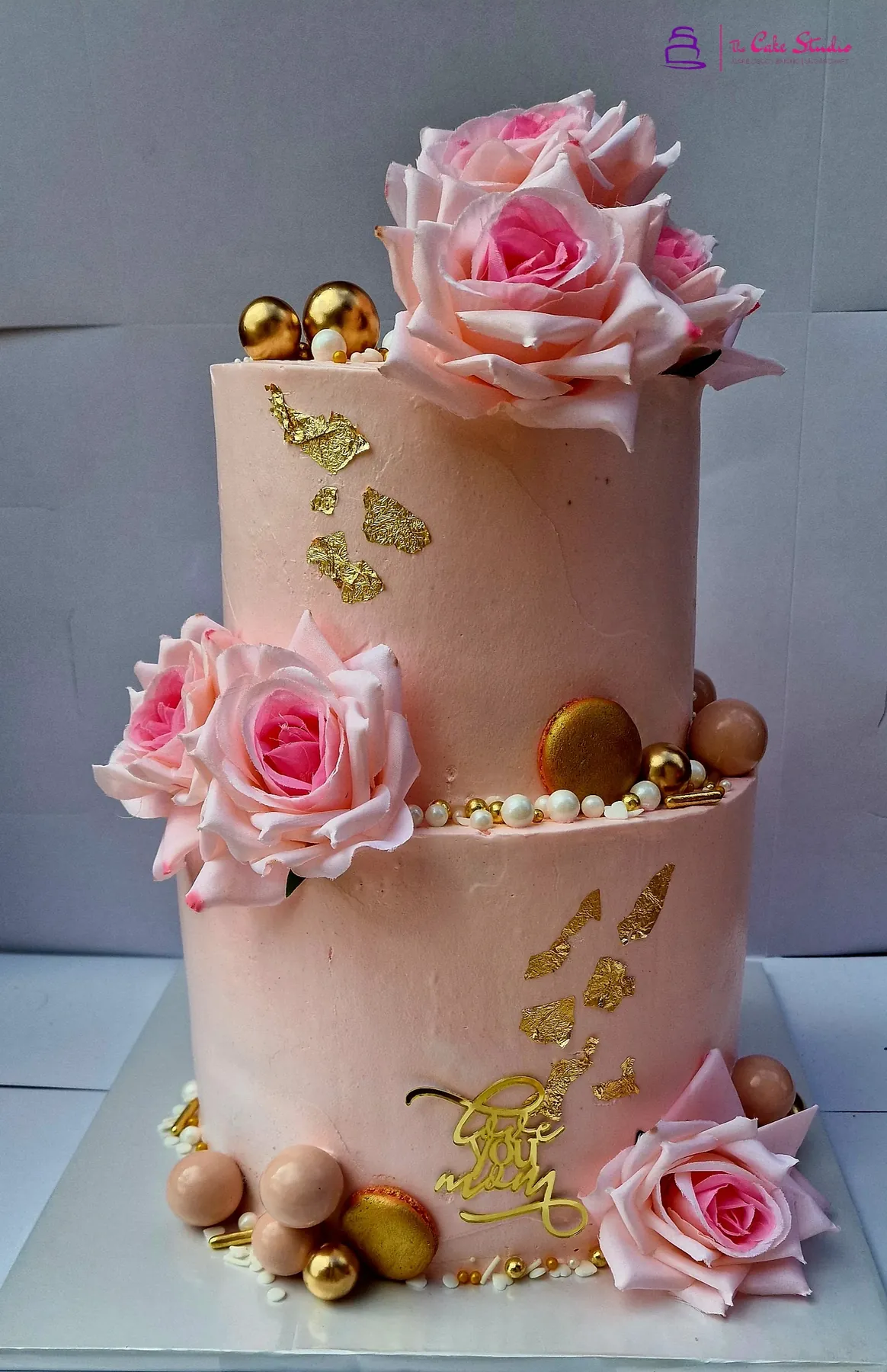 A simple vanilla cake on a plate, dusted with sugar