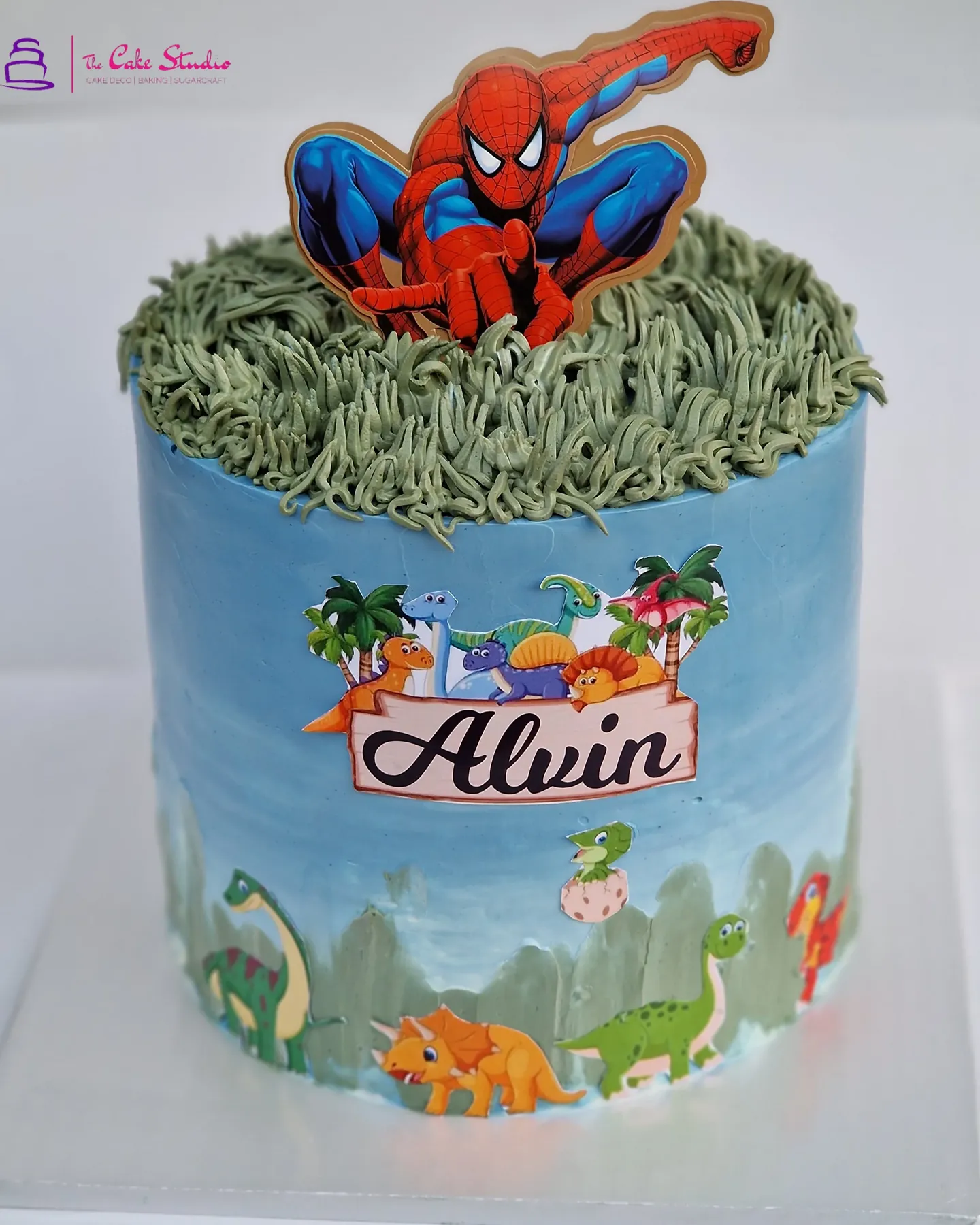 A Spider-Man and dinosaur themed character cake personalised with a child's name, baked by The Cake Studio Harare