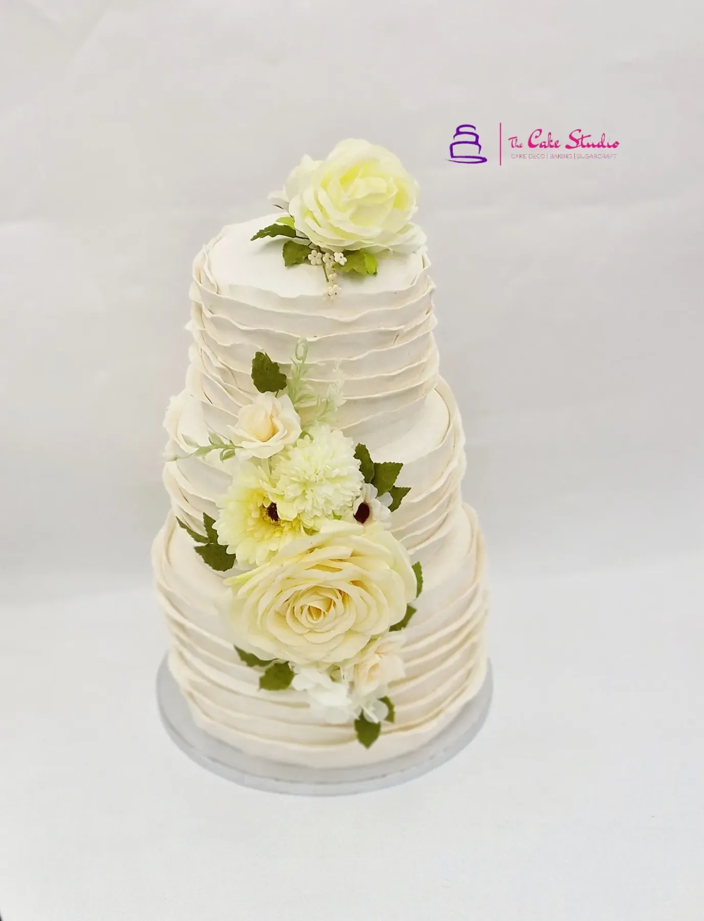A three-tier contemporary wedding cake