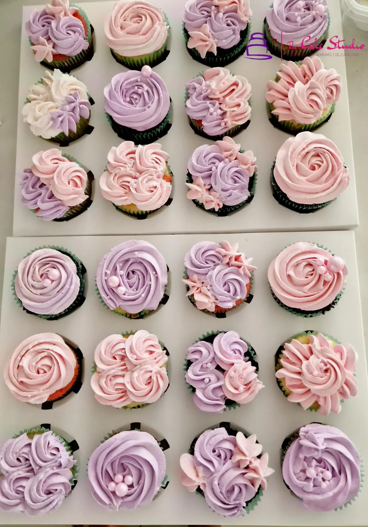 Grey and ivory buttercream cupcakes finished with gold leaf and pearls for a polished corporate event, by The Cake Studio Harare