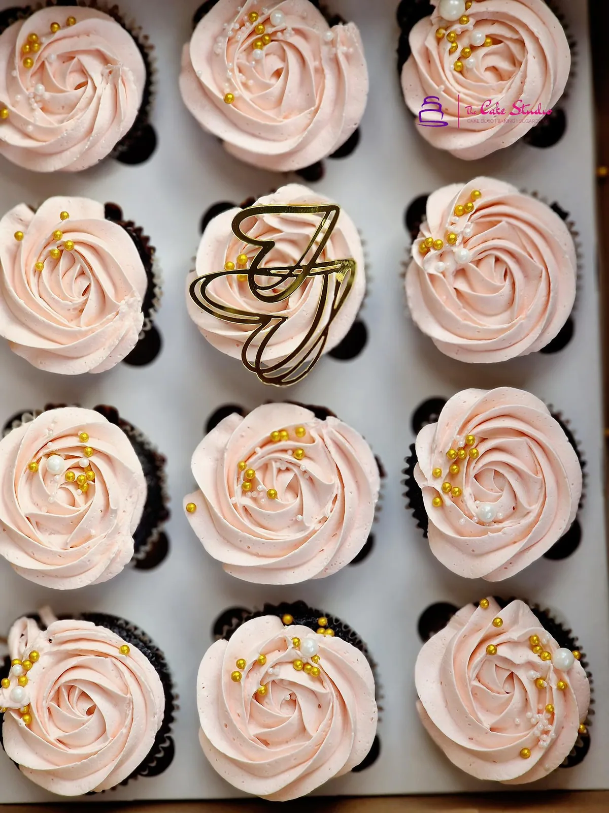 Pink and lilac buttercream cupcakes piped in mixed rosettes for a bridal shower or baby shower table, by The Cake Studio Harare