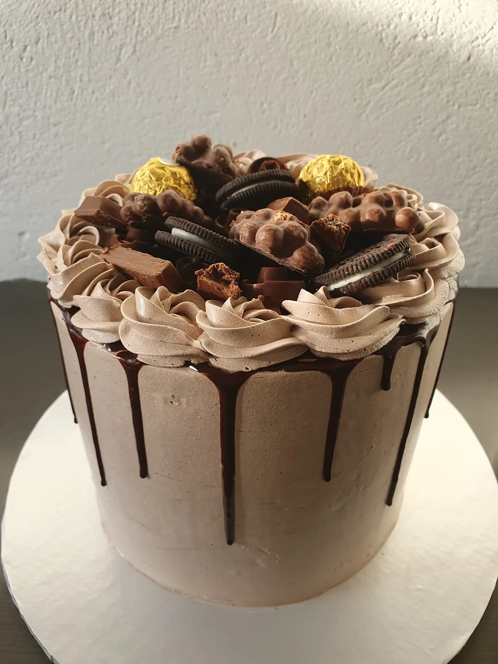 A chocolate drip cake finished for collection