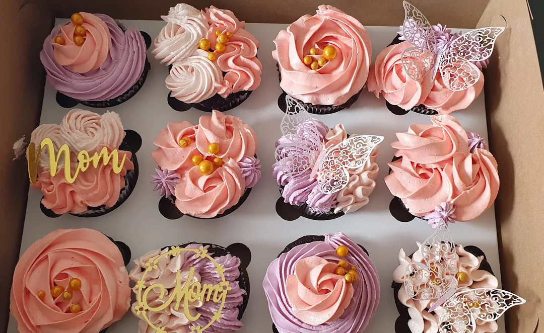 A box of decorated cupcakes