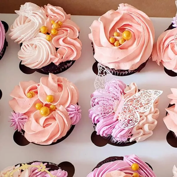 A box of celebration cupcakes ready for delivery