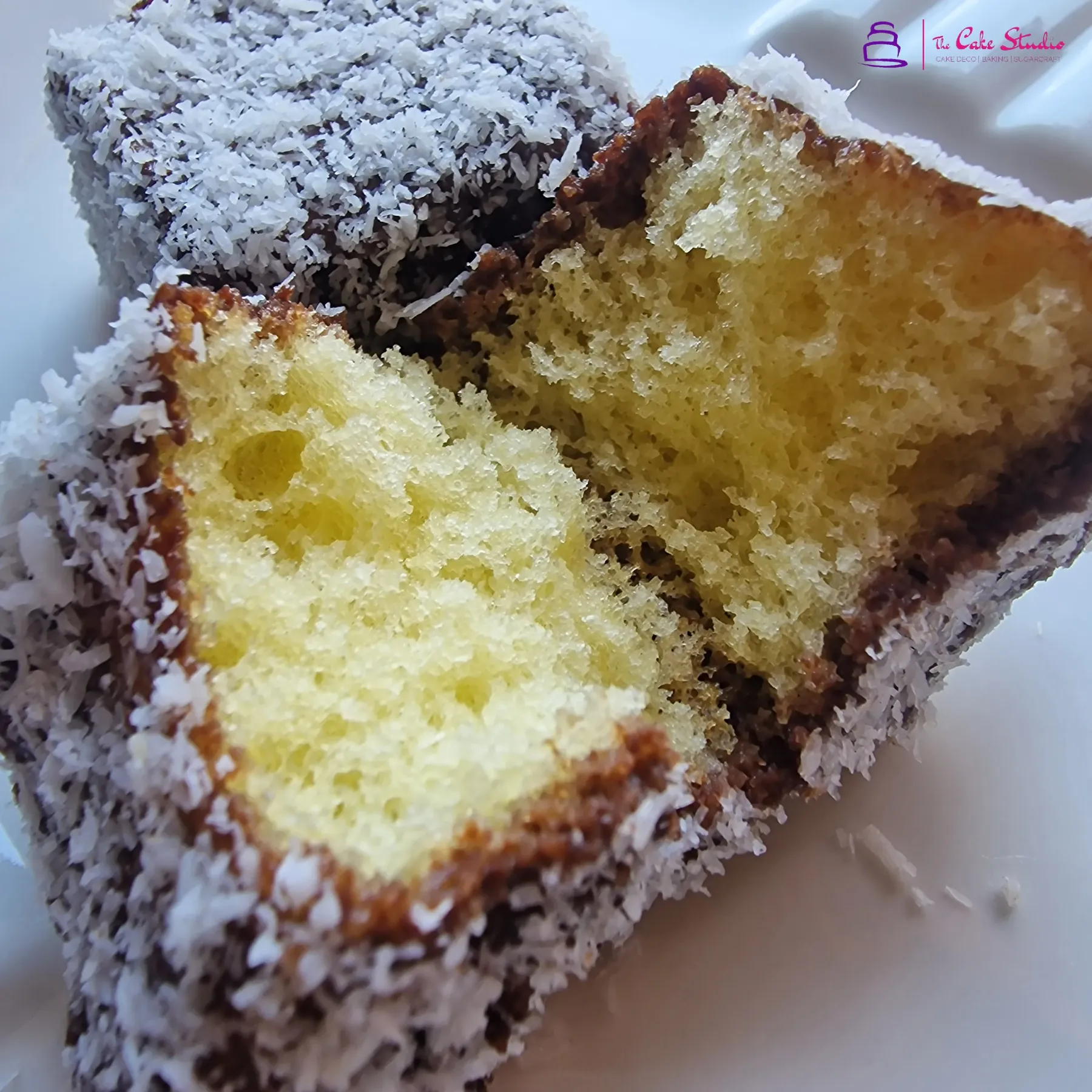 Sponge squares cut open to show a soft vanilla crumb, baked at The Cake Studio Harare