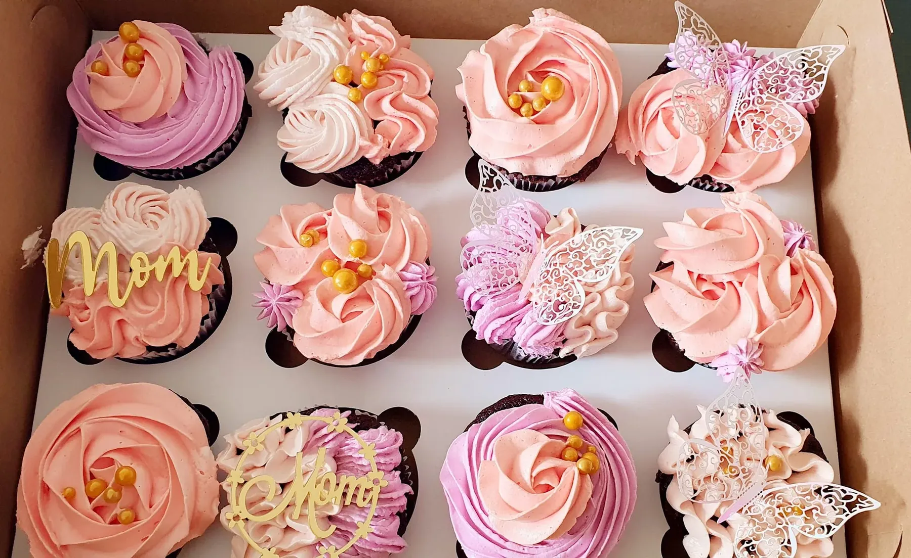 A presentation box of decorated cupcakes, the format used for branded corporate distribution