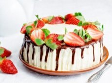 Sponge cake with cream, chocolate and strawberry. toning. selective focus